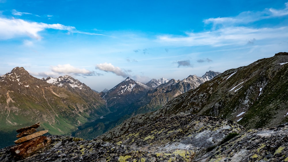 a view of a mountain range with snow on the mountains