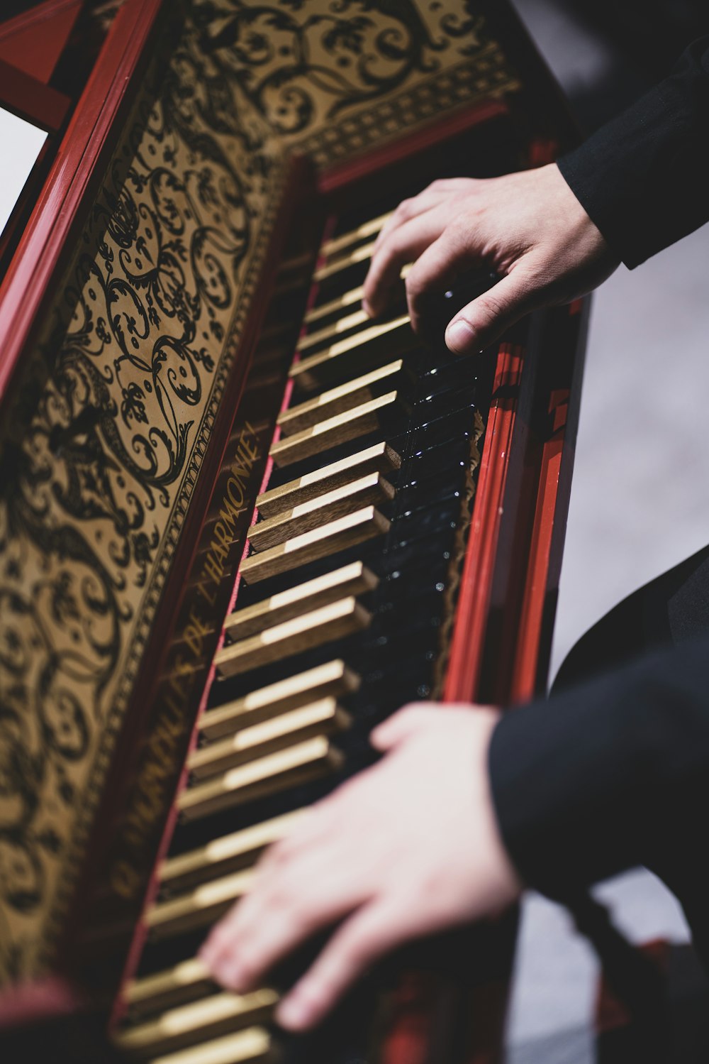 a close up of a person playing a musical instrument