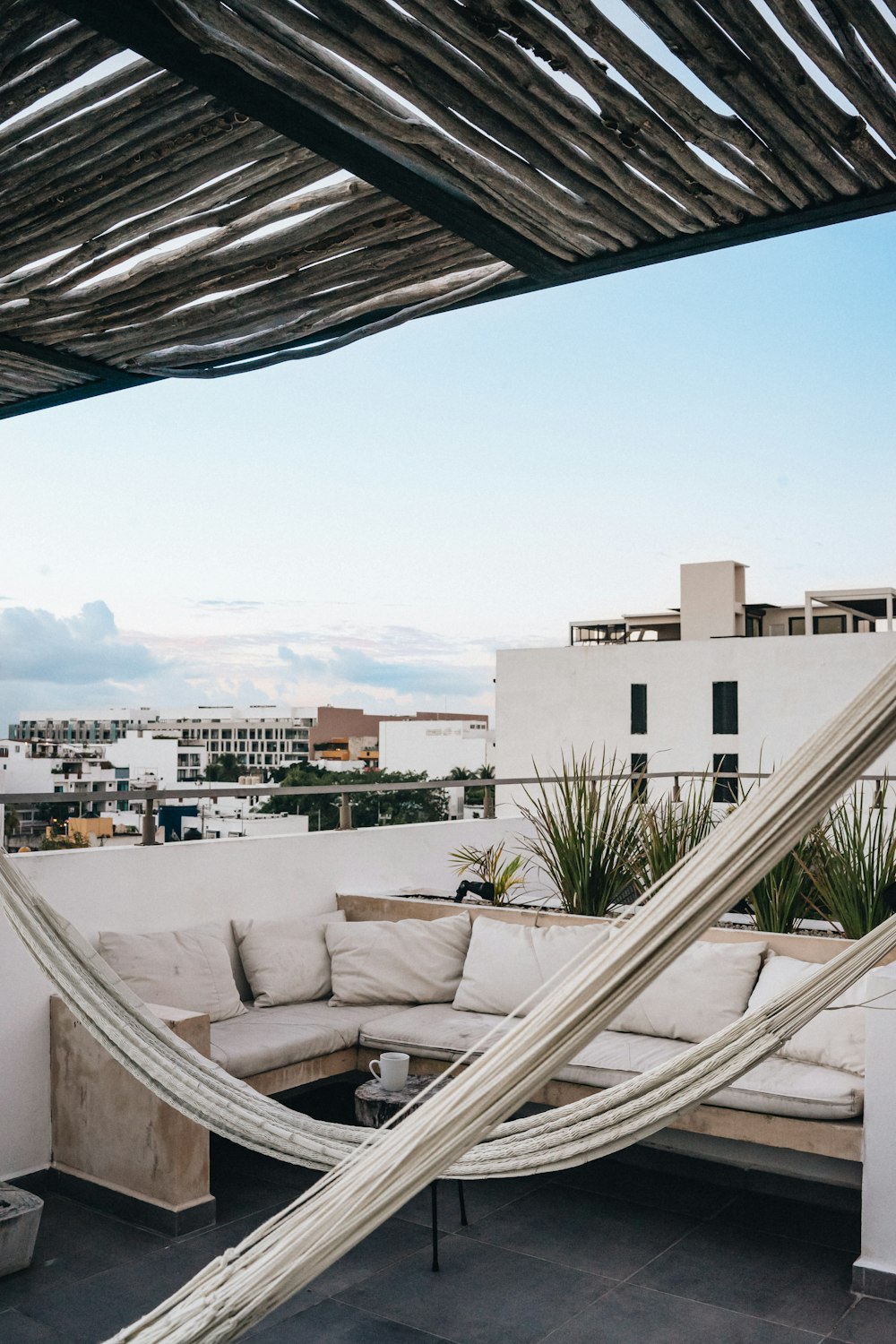 a white couch sitting on top of a roof