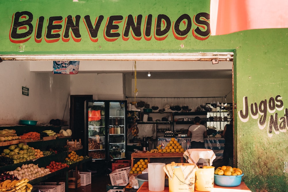 a fruit stand with a variety of fruits on display