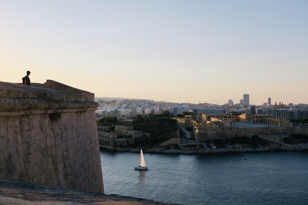 a sailboat in a body of water near a city, Overlooking the fort in Valetta