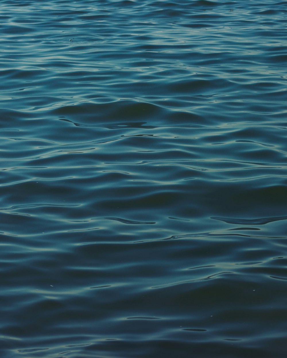 a boat floating on top of a large body of water