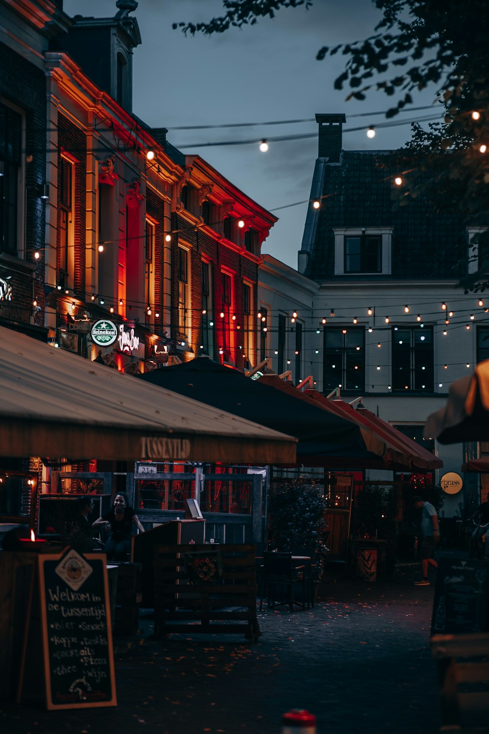 a city street at night with a lot of lights