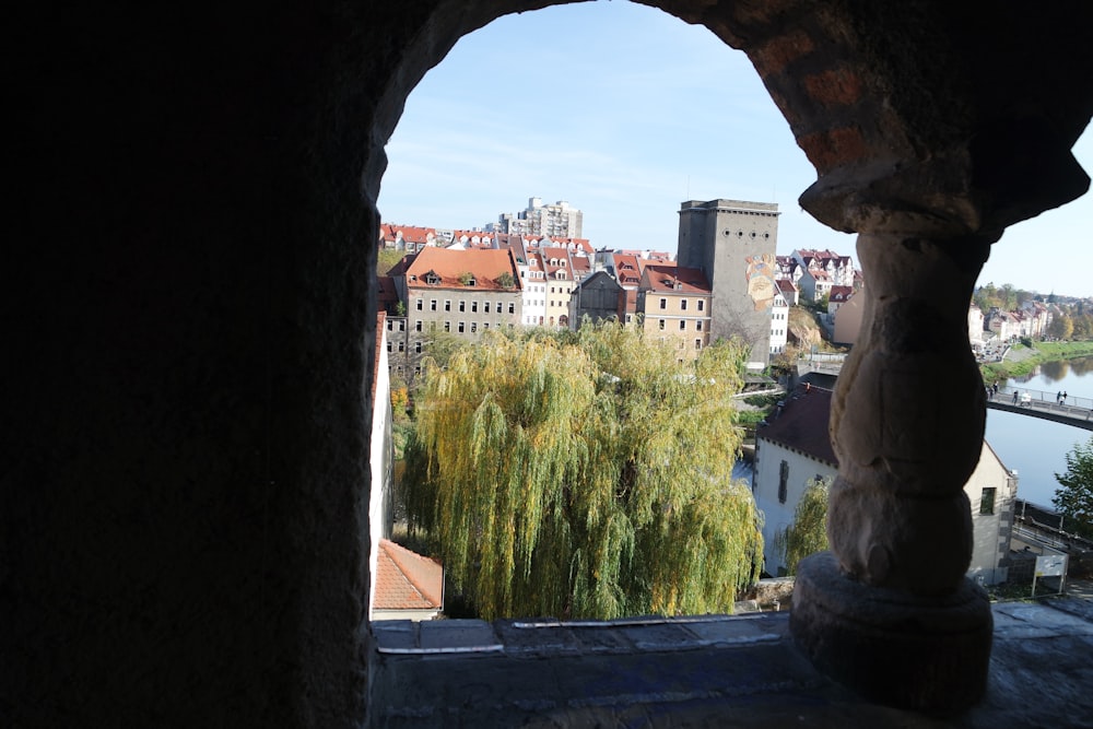 a view of a city from a window in a building