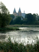 A serene landscape with a church in the background.