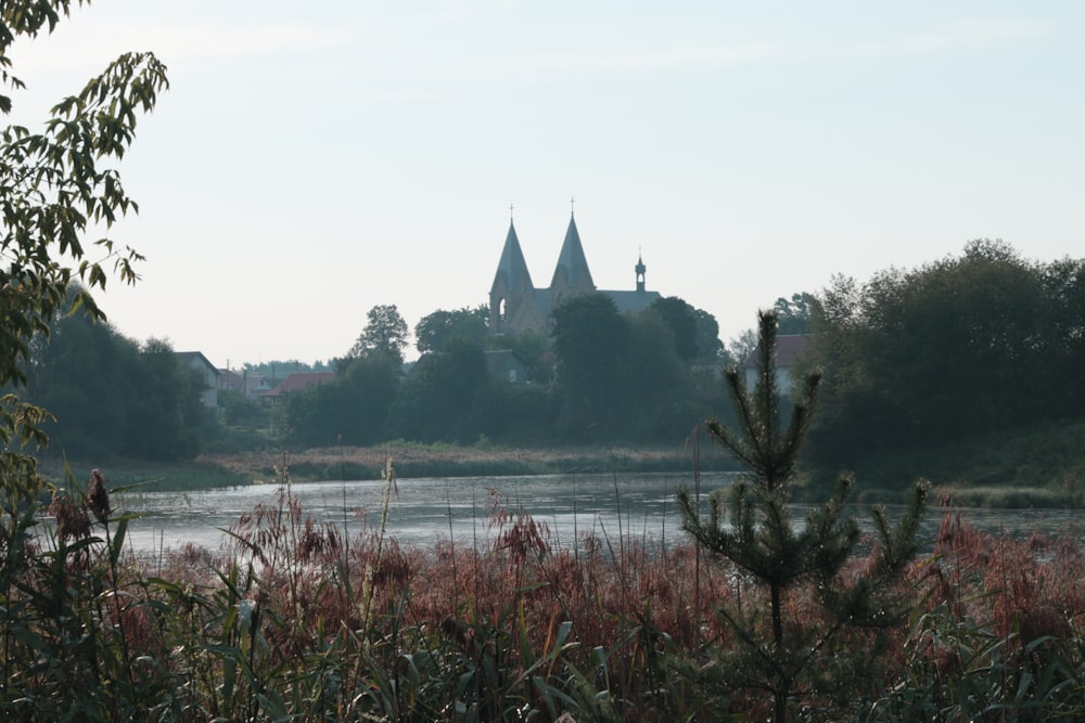 a lake with a church in the background