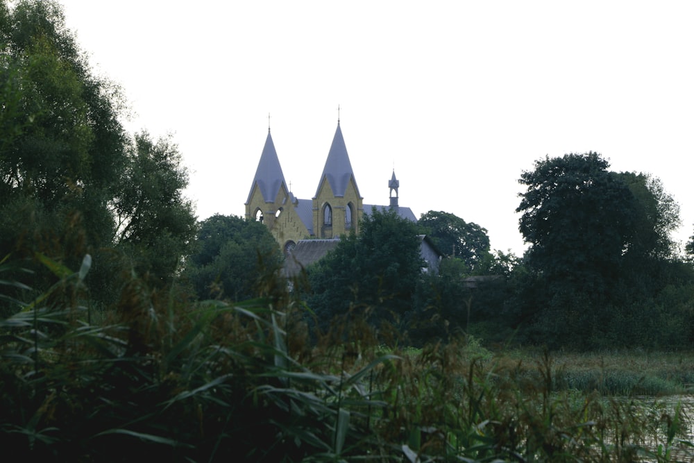 a large building with a tower near a body of water