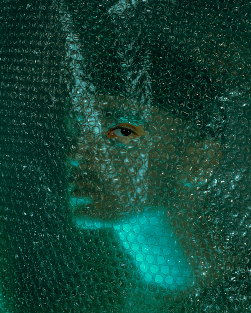 a close up of a person's face through a window
