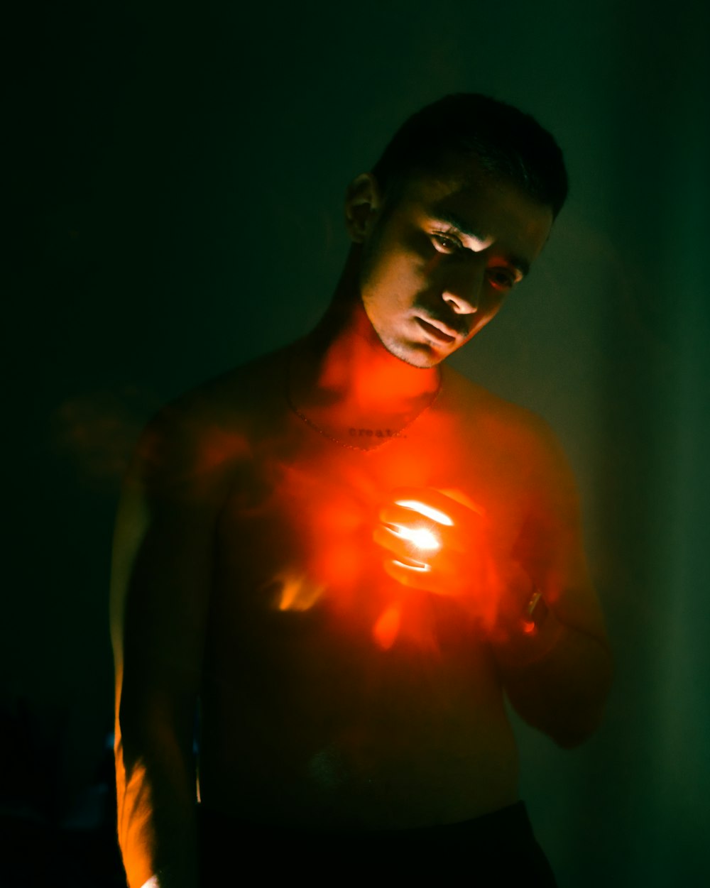 a man holding a glowing object in his hands