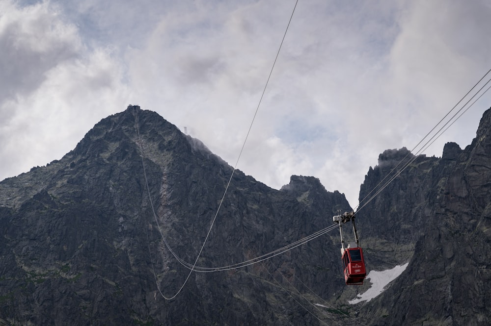 a cable car going up the side of a mountain