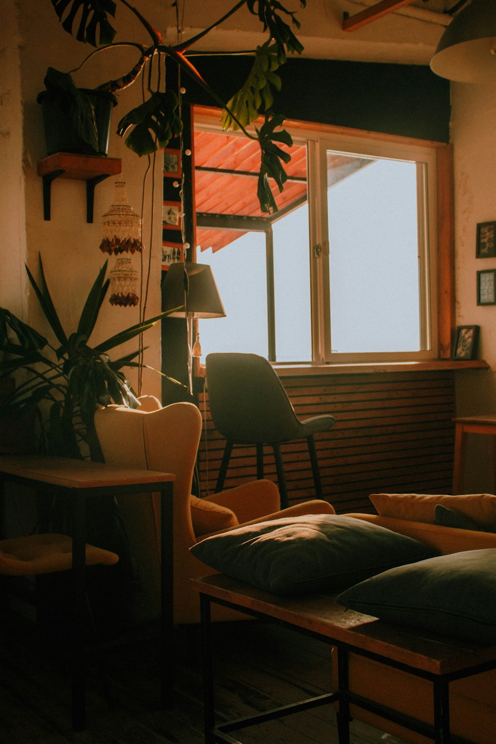 a living room filled with furniture and a window