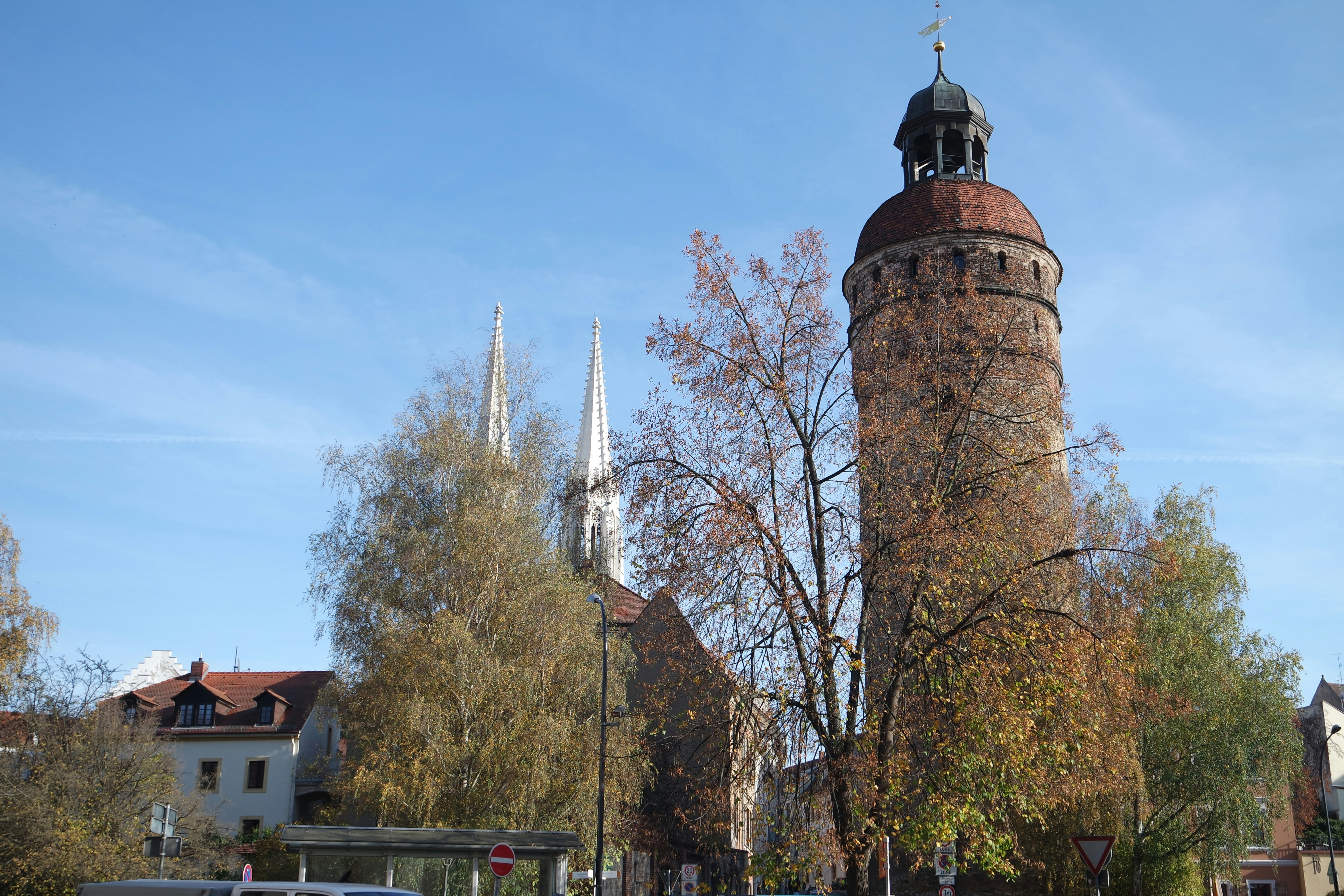 a tall tower with a clock on the top of it