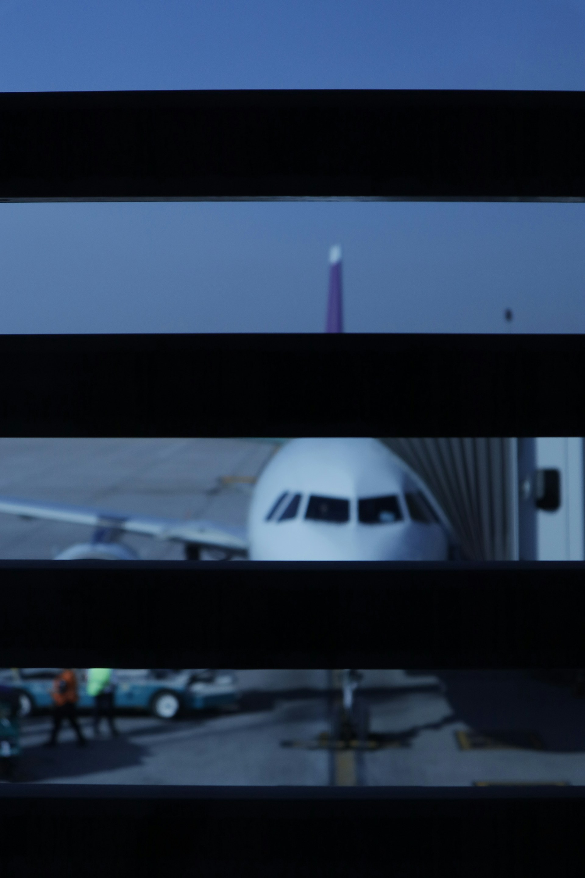 a view of an airplane from a window at an airport