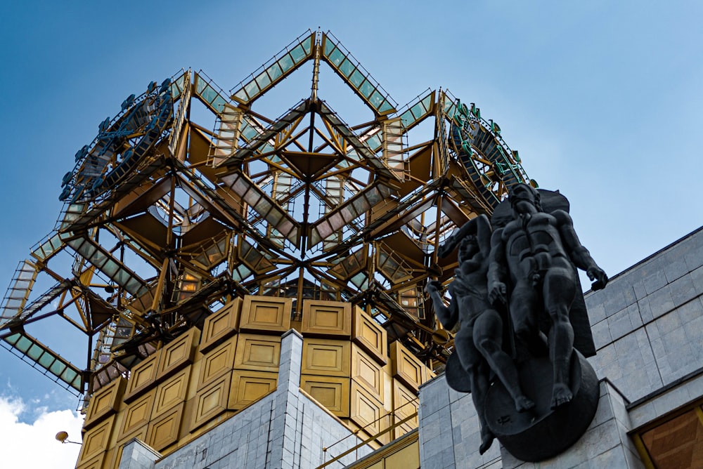 a statue of a man standing in front of a building