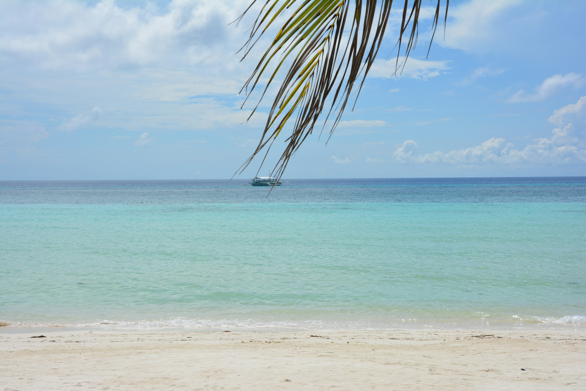 a boat is in the distance on the ocean