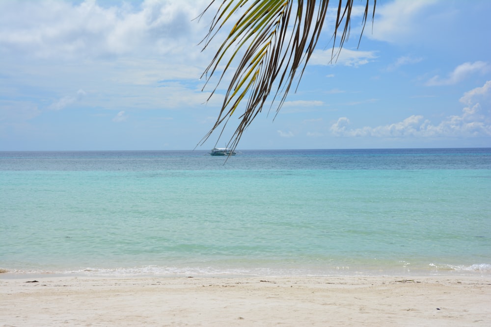 a boat is in the distance on the ocean