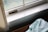 Close-up of clean HVAC vents with sunlight streaming through a window.