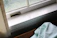 Close-up of a clean heating vent with sunlight streaming through.