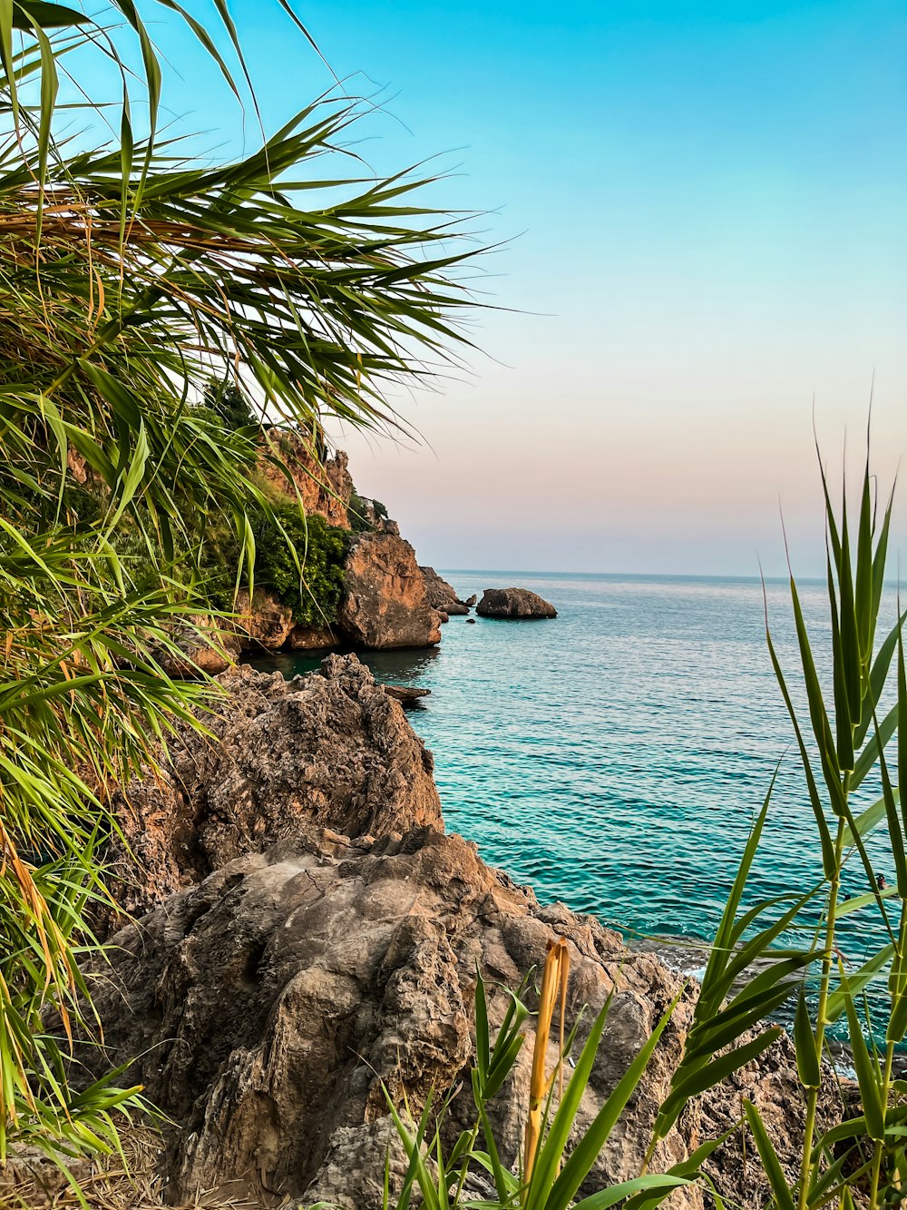 a view of a body of water from a cliff