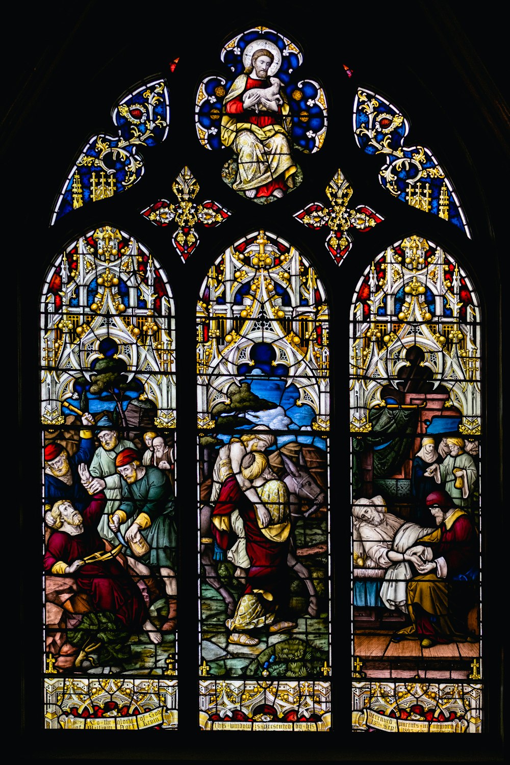 a stained glass window depicting a scene of a birth of jesus