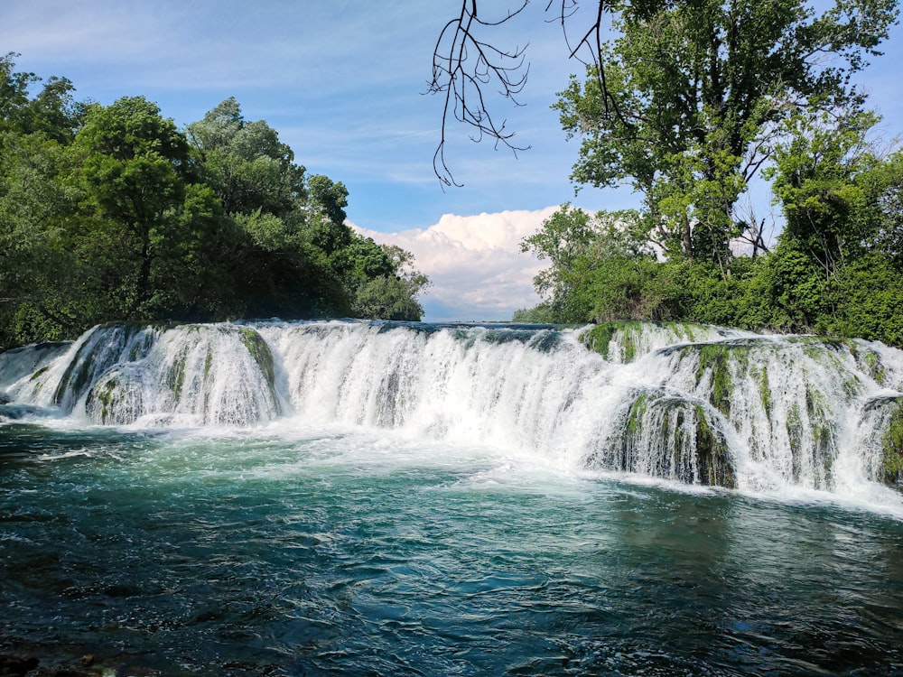 a large waterfall with water cascading over it