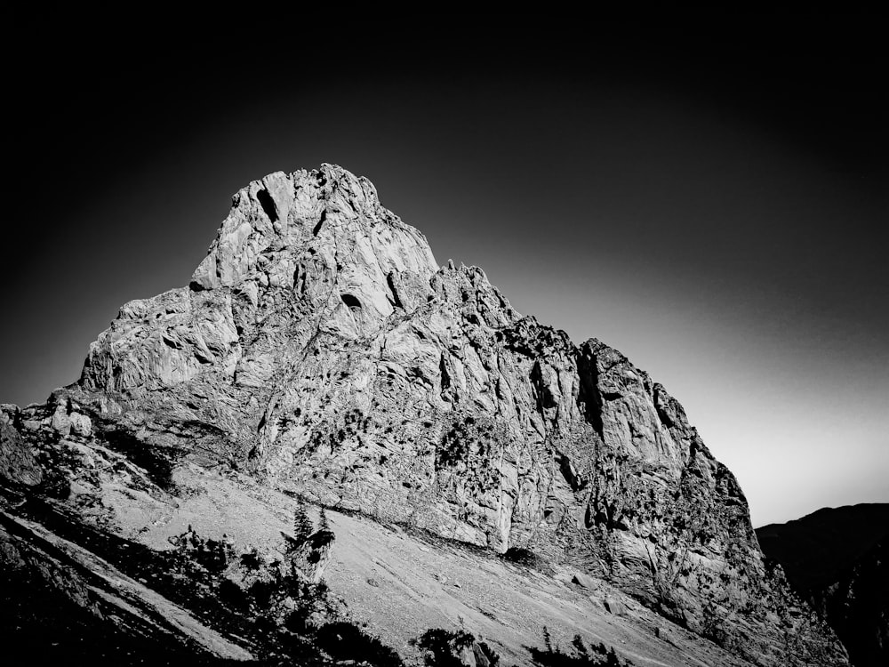 a black and white photo of a mountain