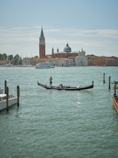 Couple sharing a joyful moment on a gondola ride through the canals of Venice.