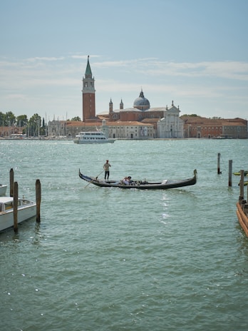Couple sharing a joyful moment on a gondola ride through the canals of Venice.