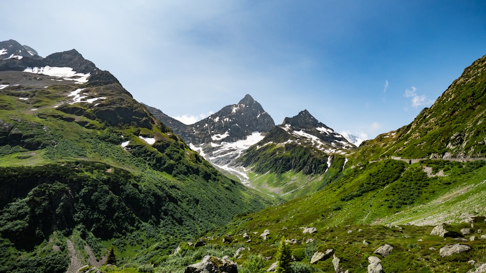 a view of a mountain range with a road going through it