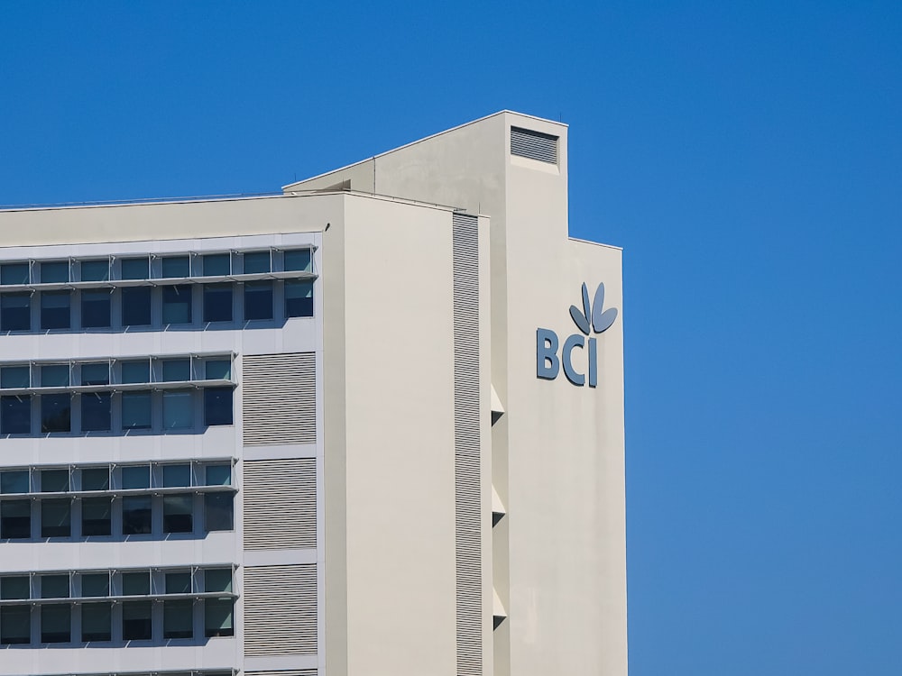 a tall building with a blue sky in the background