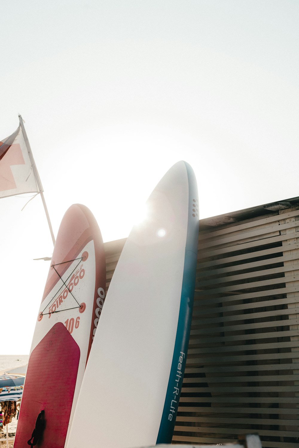 the surfboard is leaning against the wall of the building