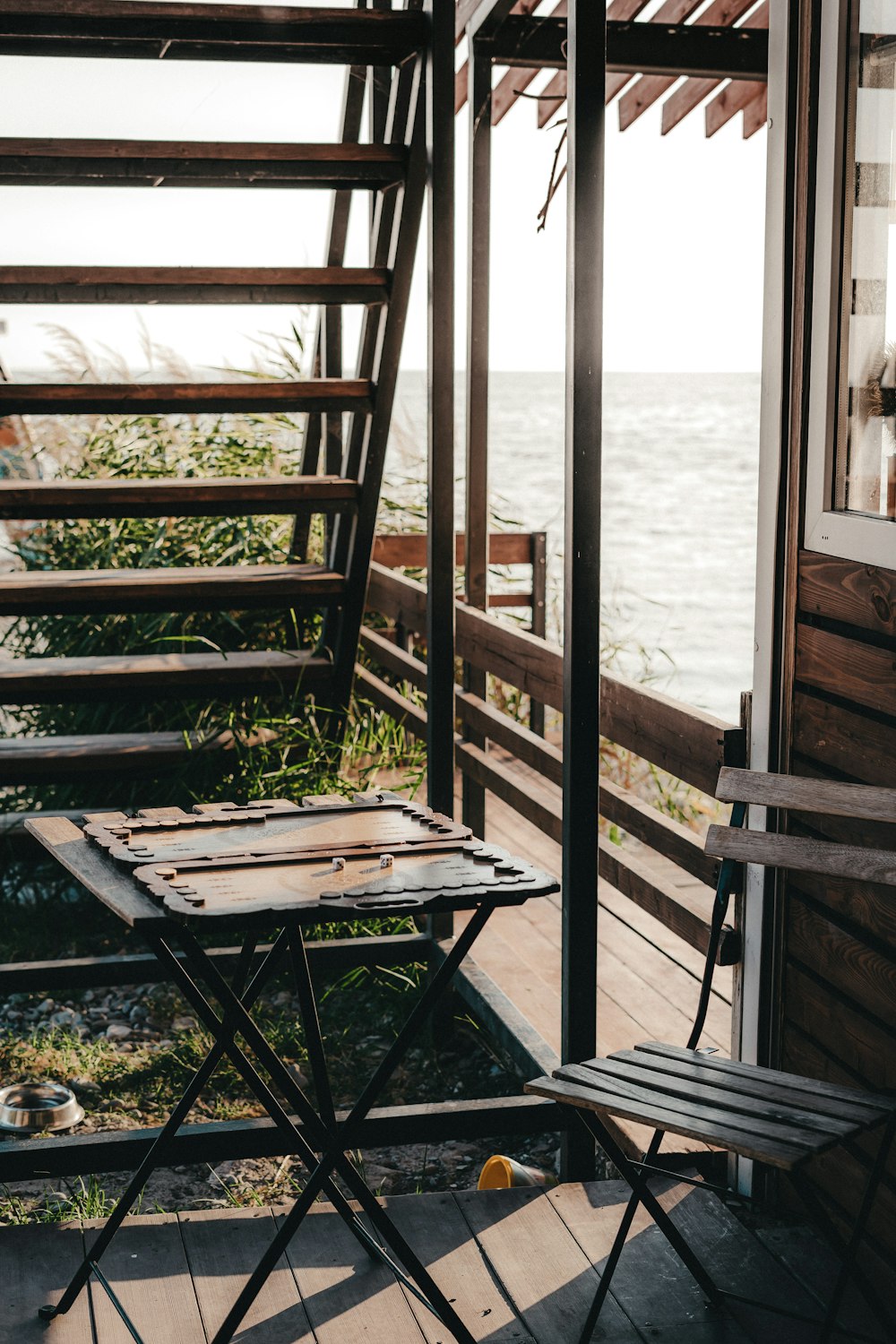 a chair and a table on a wooden deck