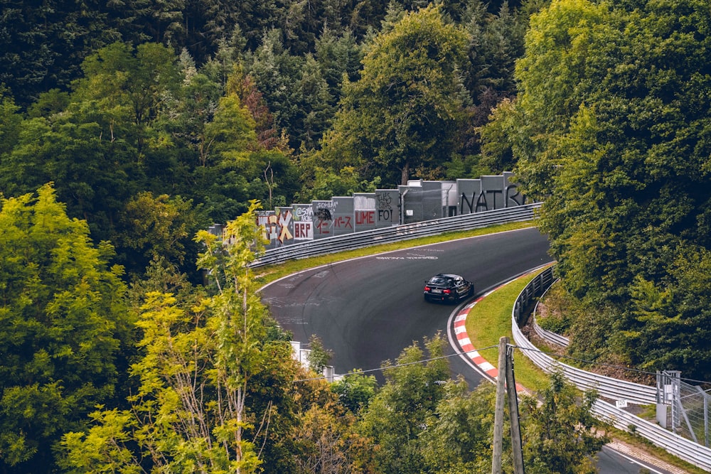 a car driving down a winding mountain road