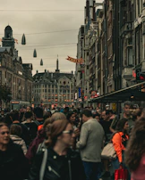 Tourists laughing and listening intently to stories on historic Fremont Street.