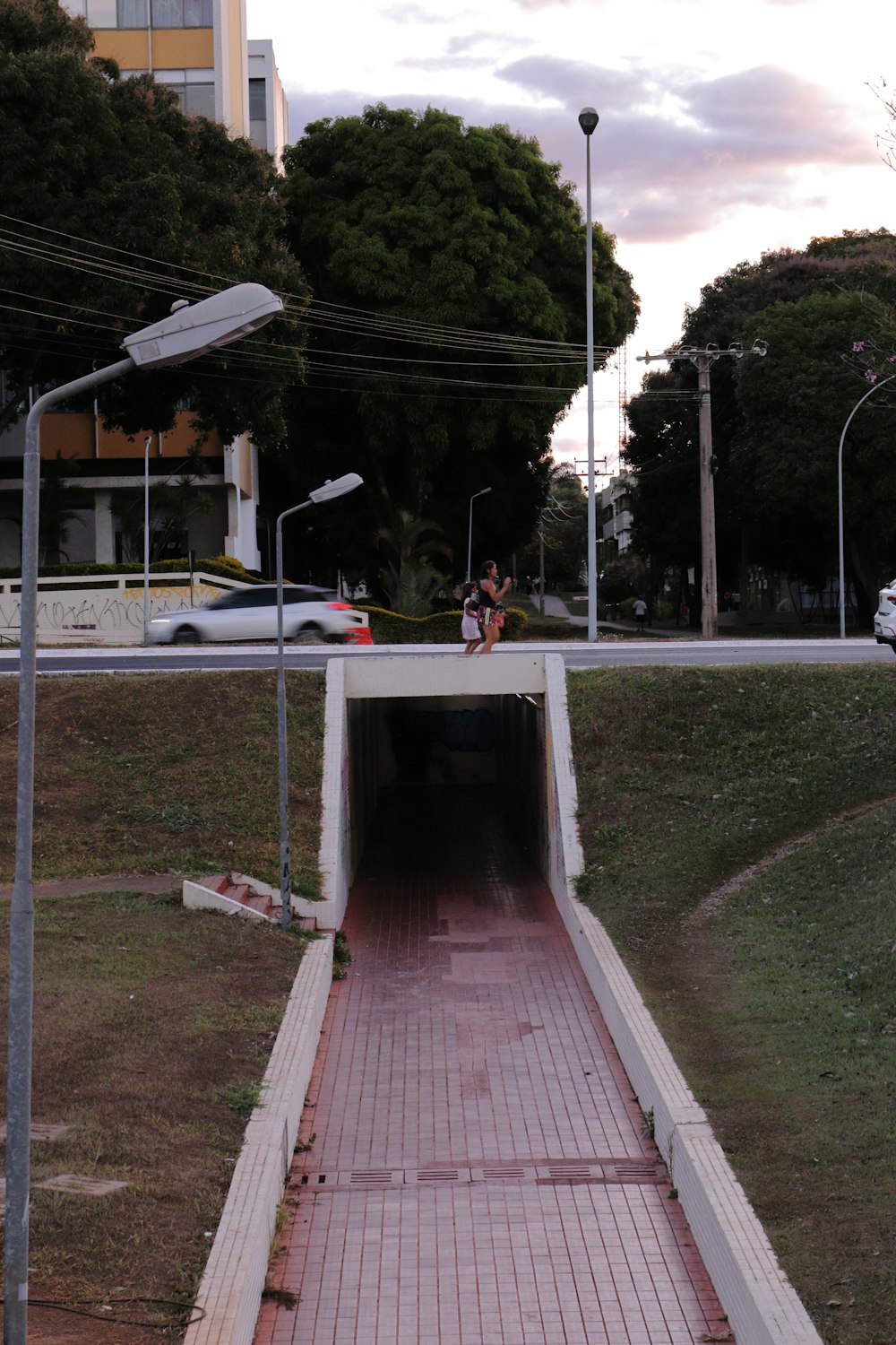 a man riding a skateboard into a tunnel