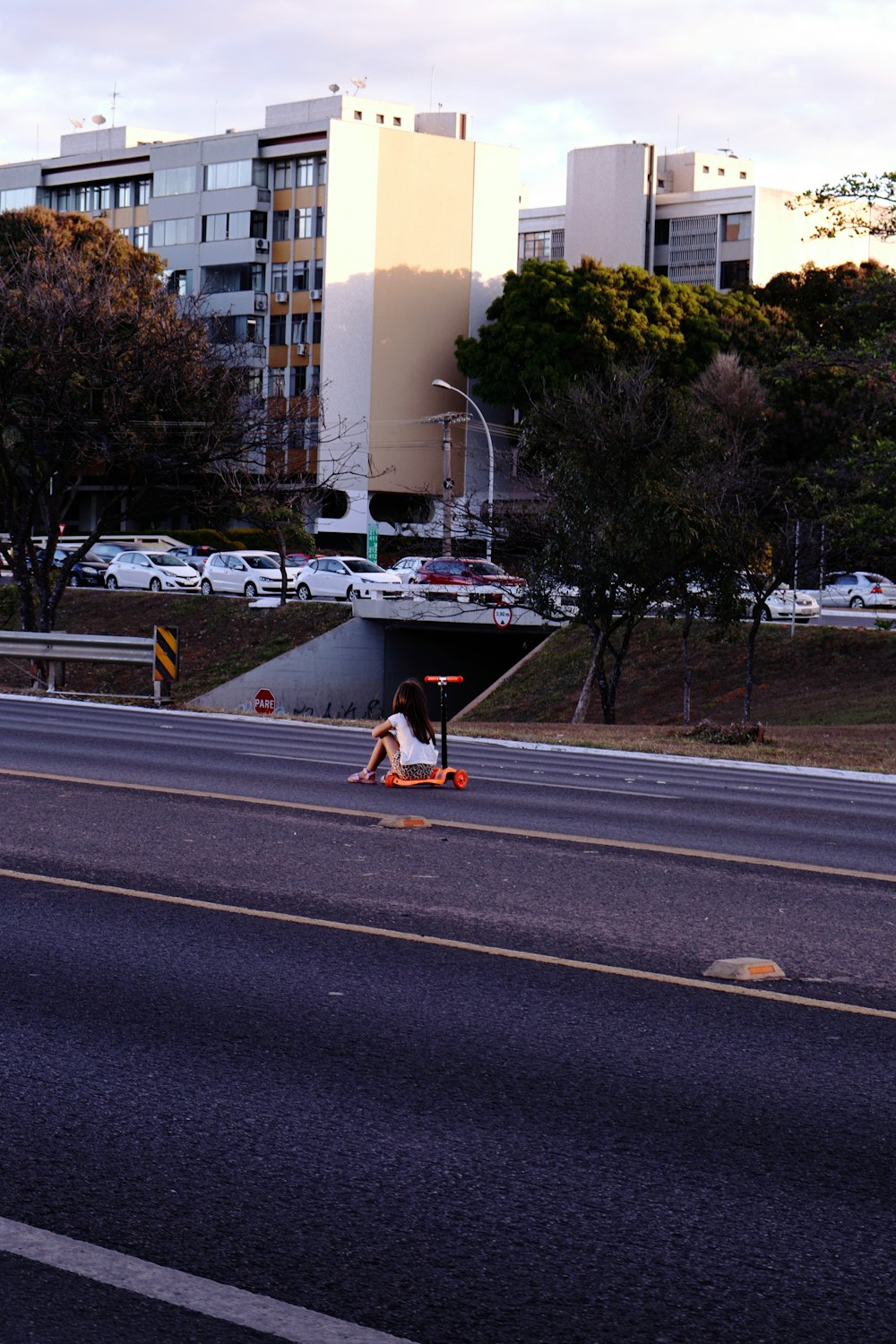 a man riding a skateboard down the side of a road