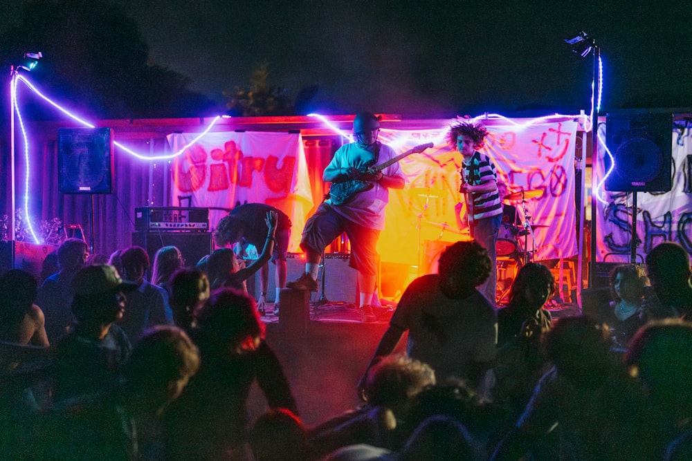 a group of people standing on top of a stage