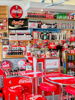Vintage Coca-Cola collectibles including bottles and branded memorabilia.
