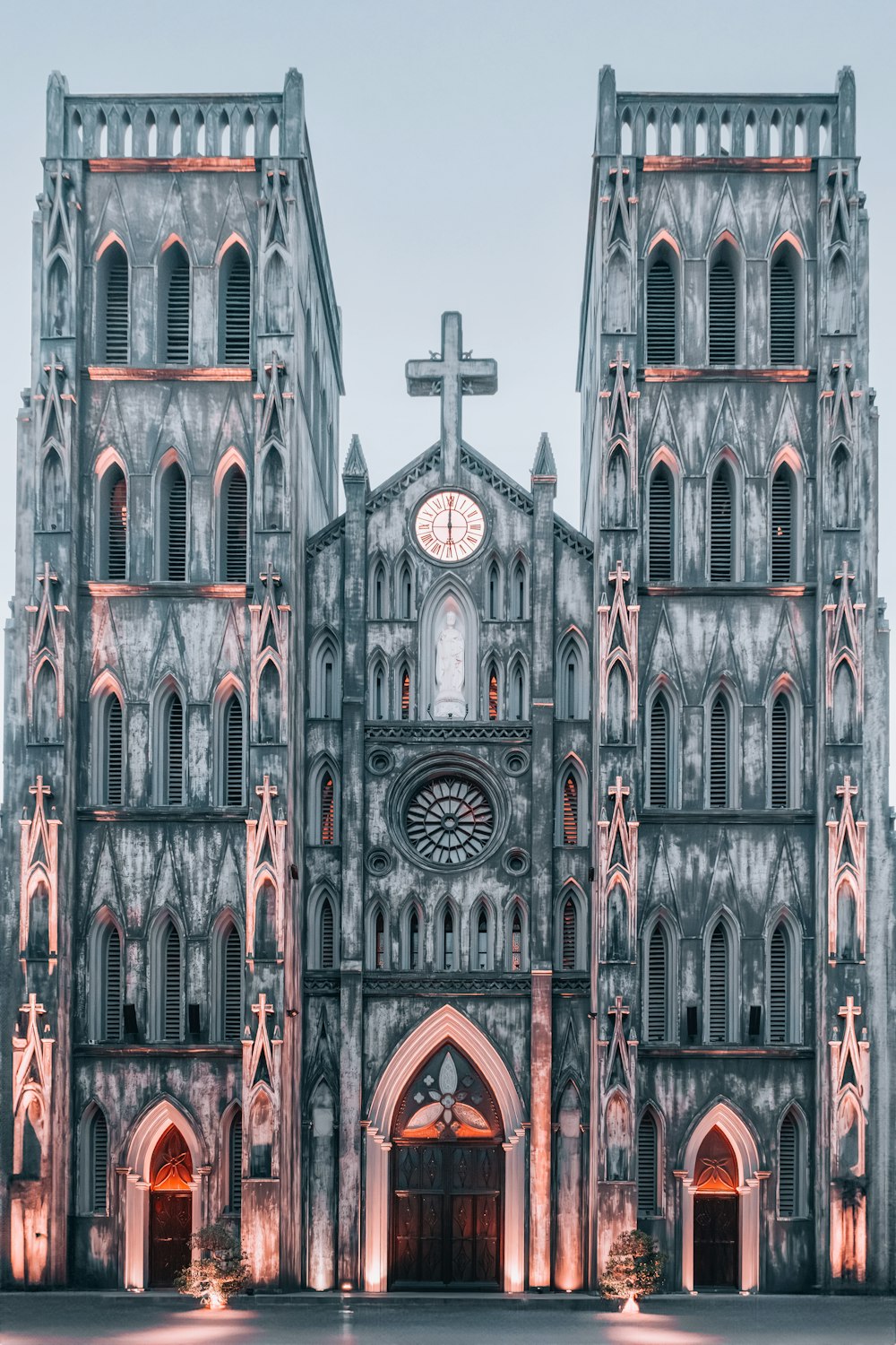 a large cathedral with a clock on the front of it