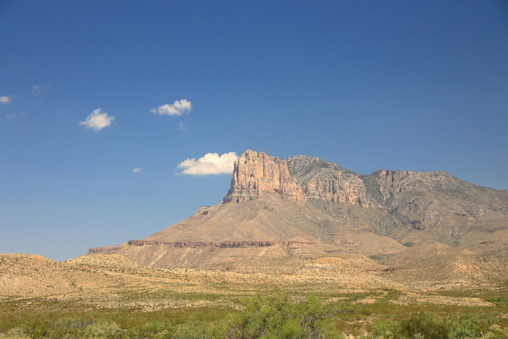 a mountain with a cloud in the sky