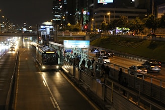 a city street filled with traffic at night
