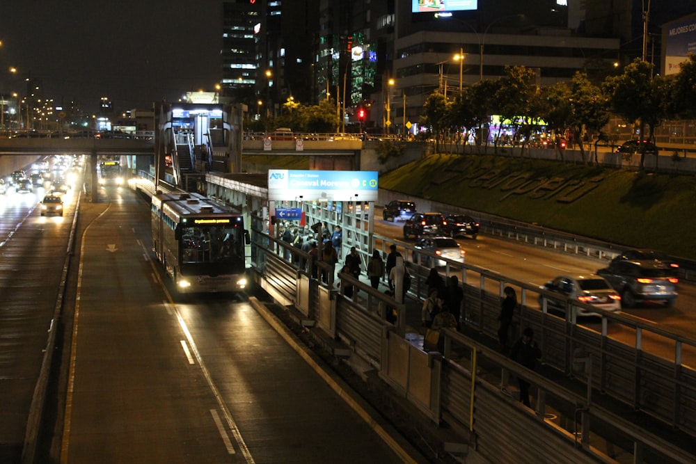 a city street filled with traffic at night