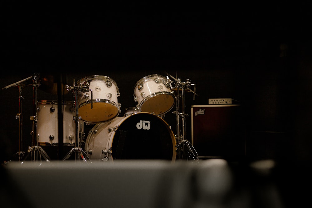 a close up of a drum set in the dark
