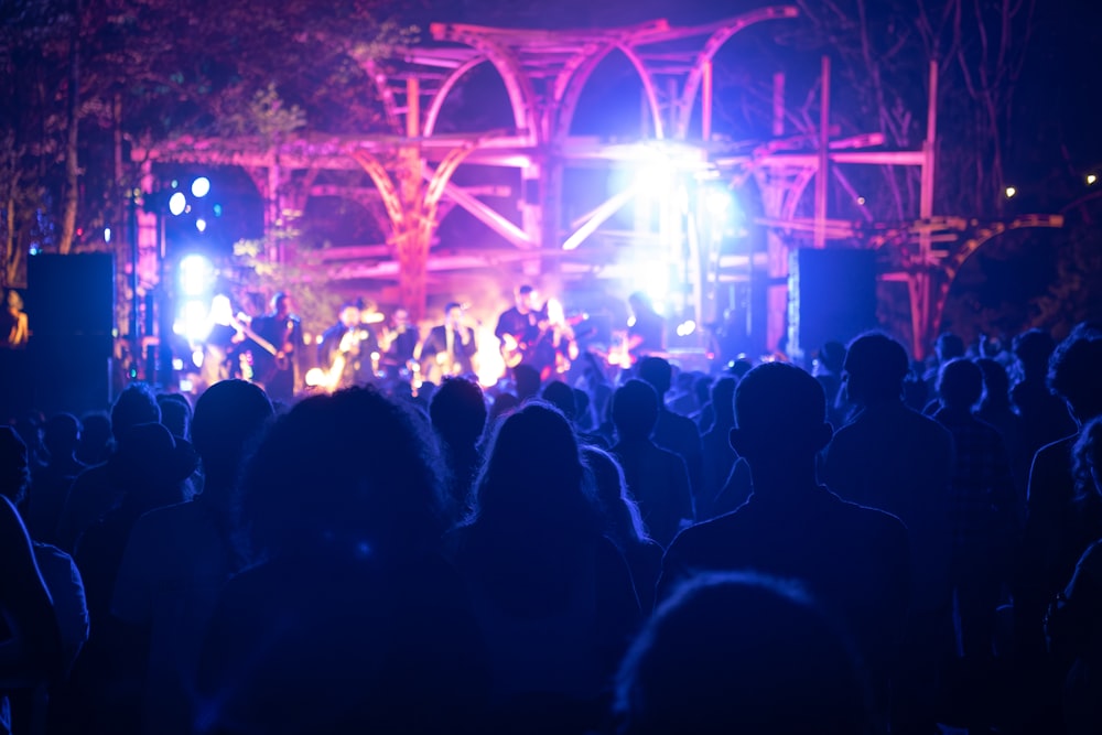 a group of people standing on top of a stage