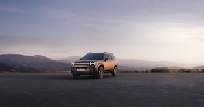 An appealing image of an SUV parked in a beautiful landscape.