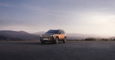 A versatile SUV from another brand, parked by a scenic countryside road.