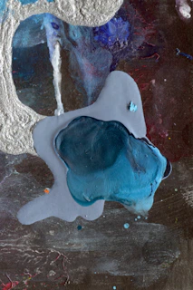 Abstract urban visuals blending deep blues and grays with hints of silver light.