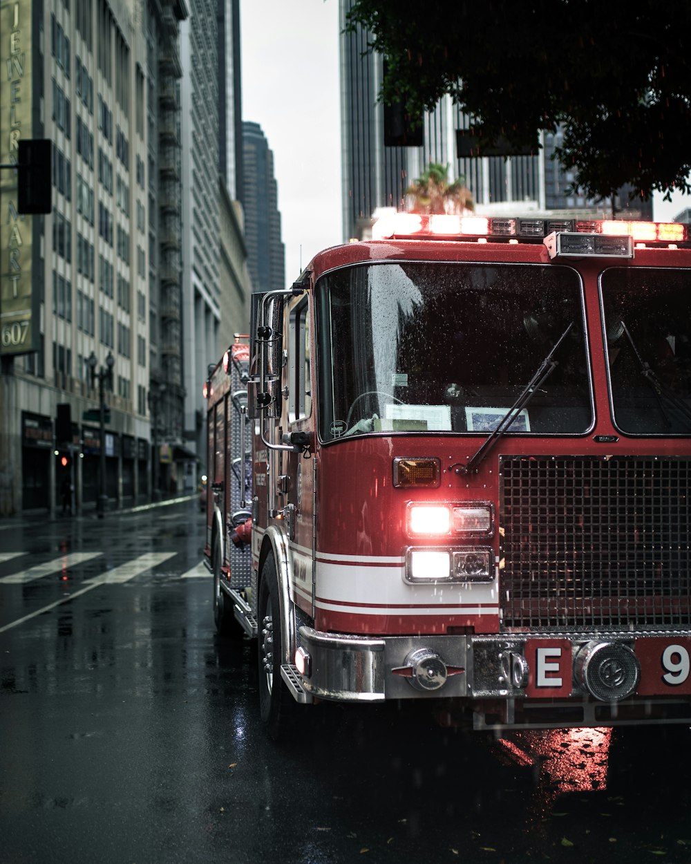 Red fire truck blowing water in a building during daytime photo – Free  Truck Image on Unsplash