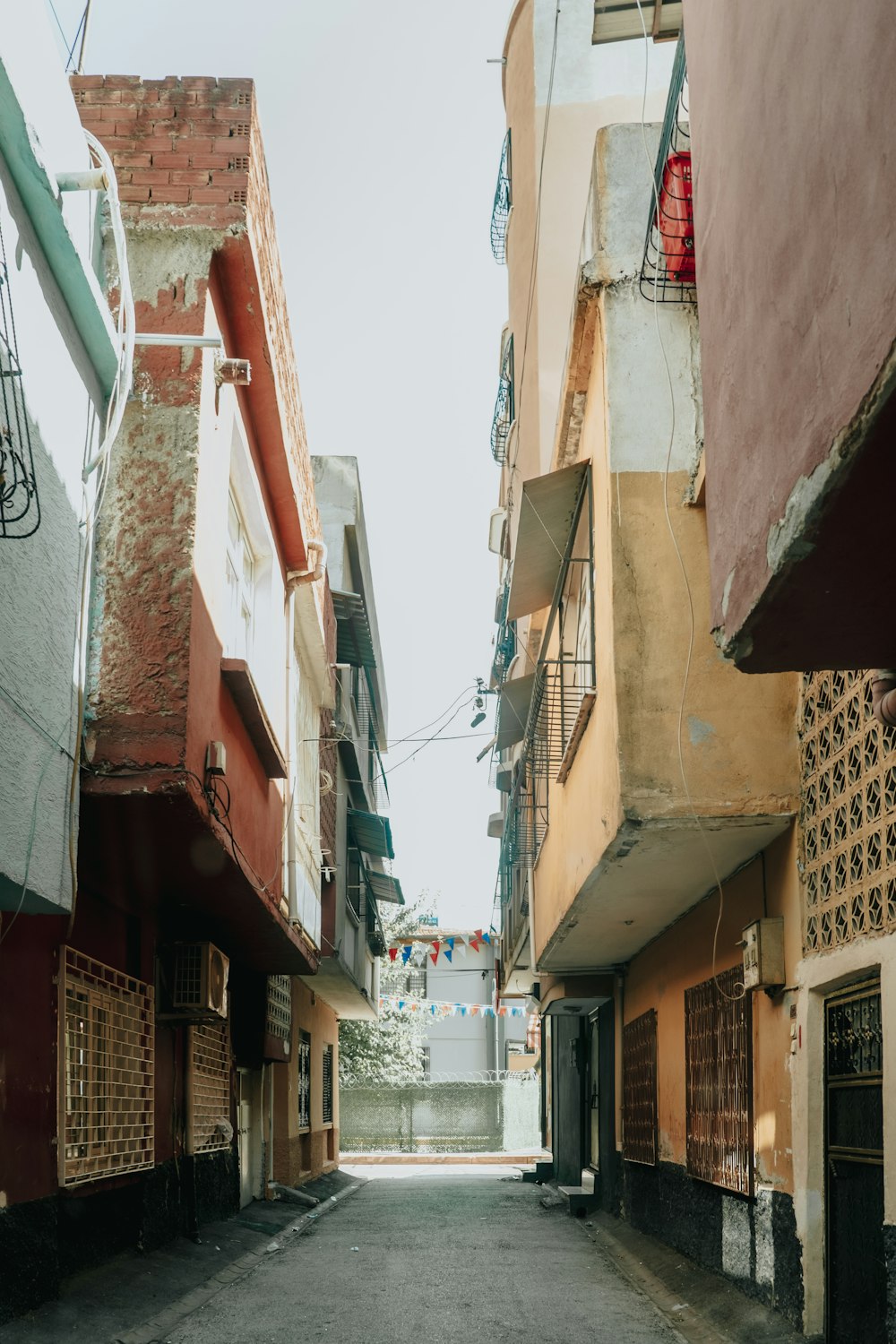 a narrow street with buildings on both sides