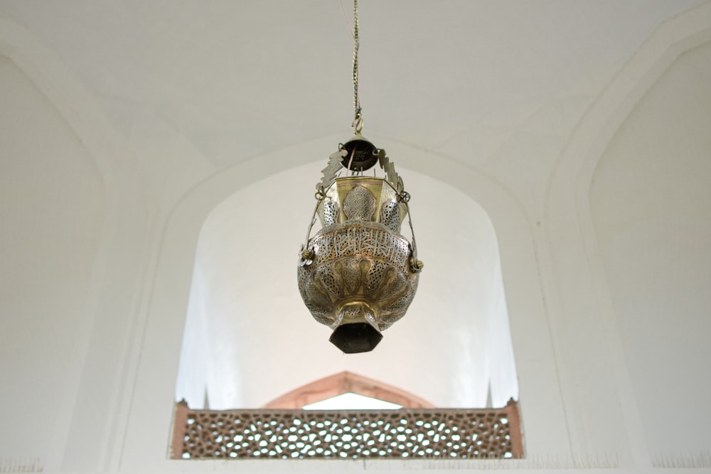 a large metal object hanging from a ceiling